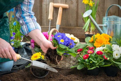Electric low-emission gardening van parked outside a property